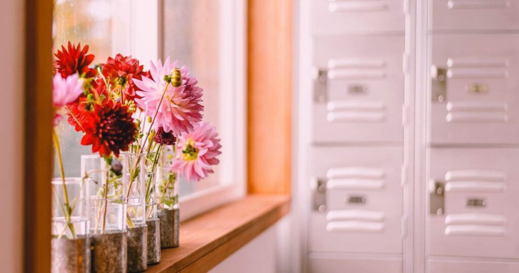 Repurposed school locker painted white and placed inside a home for storage