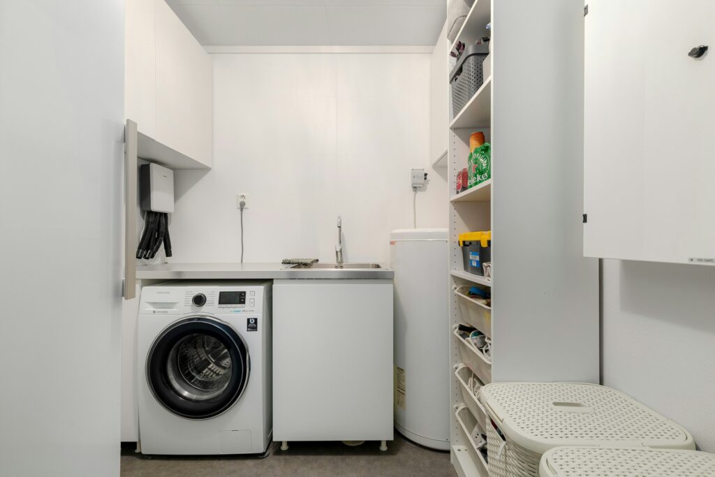 Smart storage solutions can help you maximize your small laundry room’s limited space.