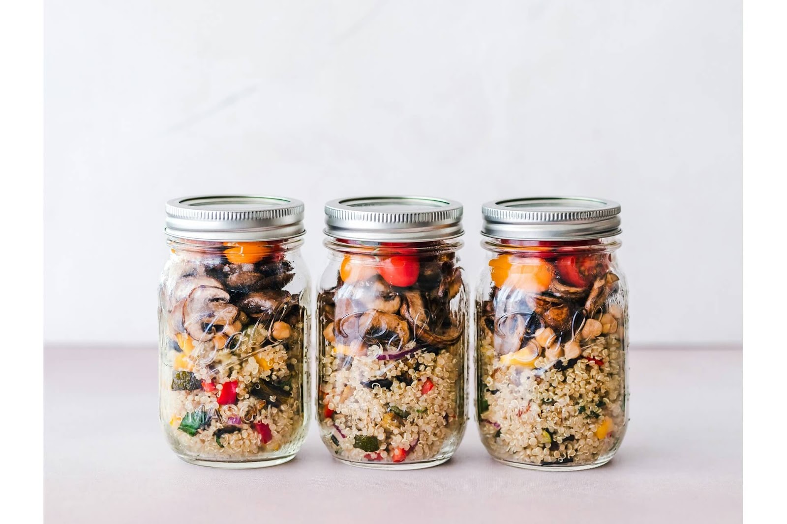 Pack a gourmet lunch with a sealed jar filled with couscous and fried vegetables.