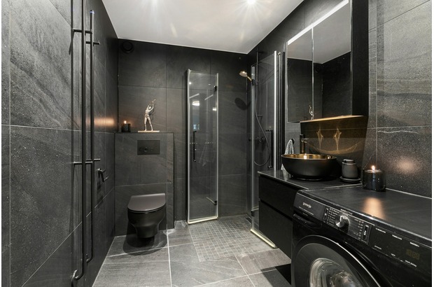 Elevate your man cave bathroom and include laundry duty too with color and innovation.