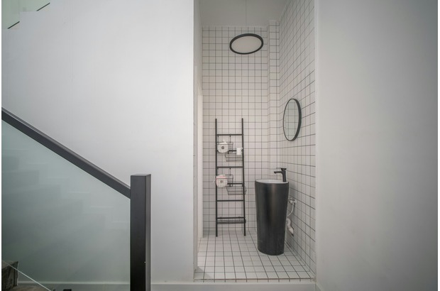 Any space, even tucked under stairs, can become a wet room bathroom.