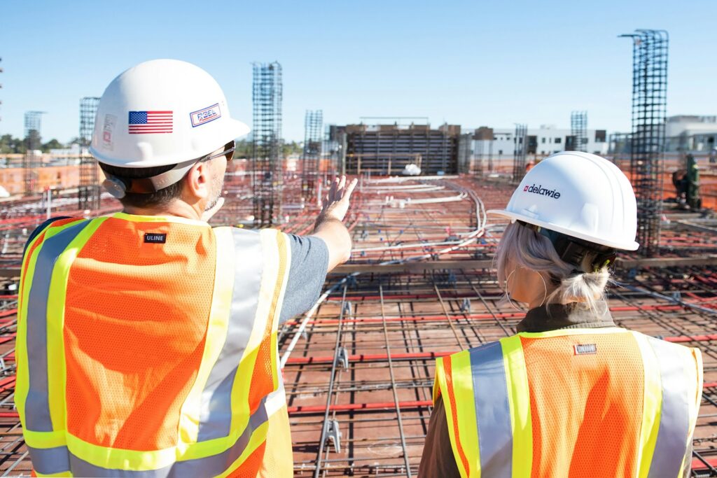 construction workers wearing hard hats on a construction site