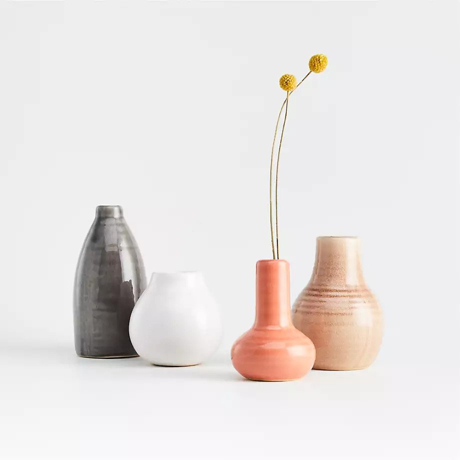 a variety of ceramic pots in different colors