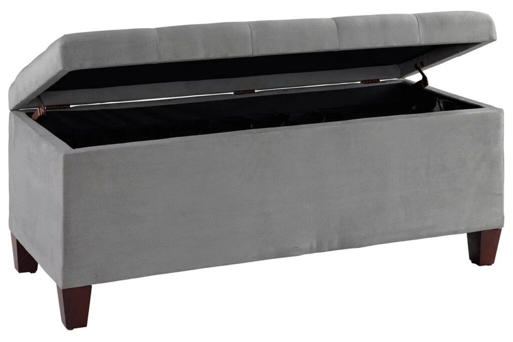 an open grey storage ottoman