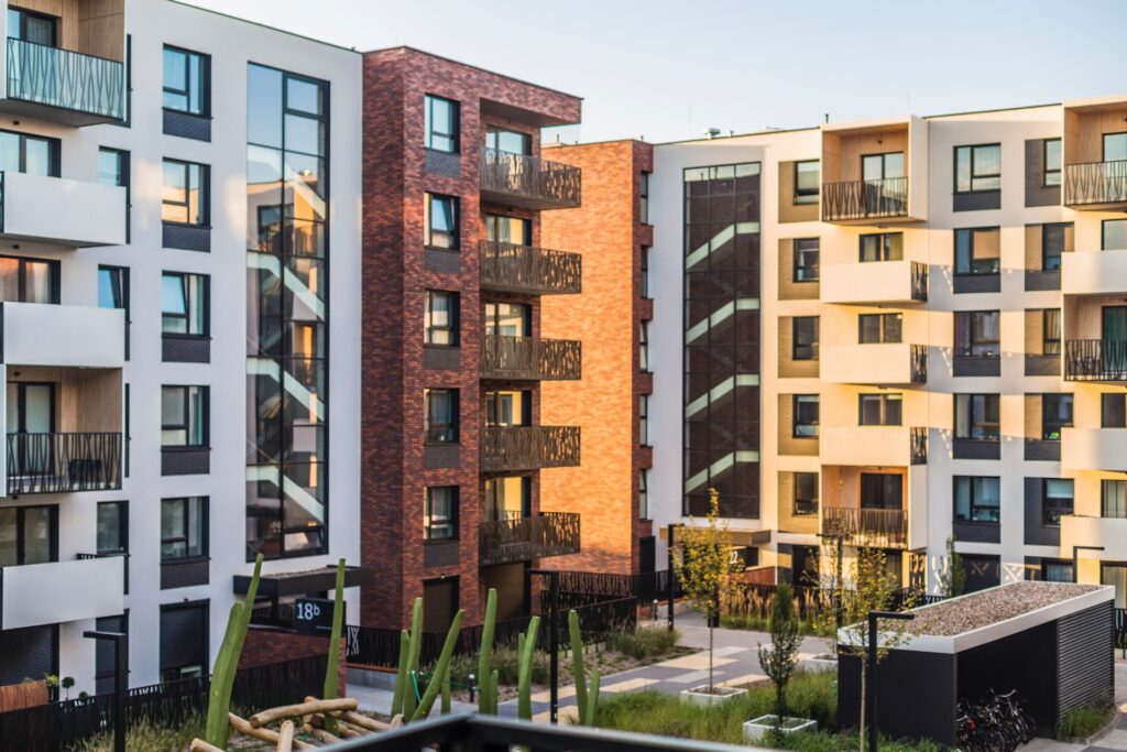 white, red, orange, and beige apartment buildings