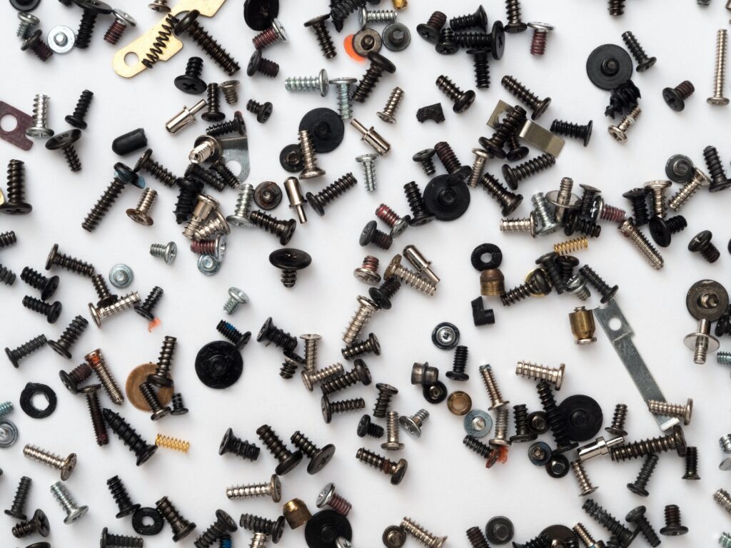 a variety of colorful screws and hanging supplies