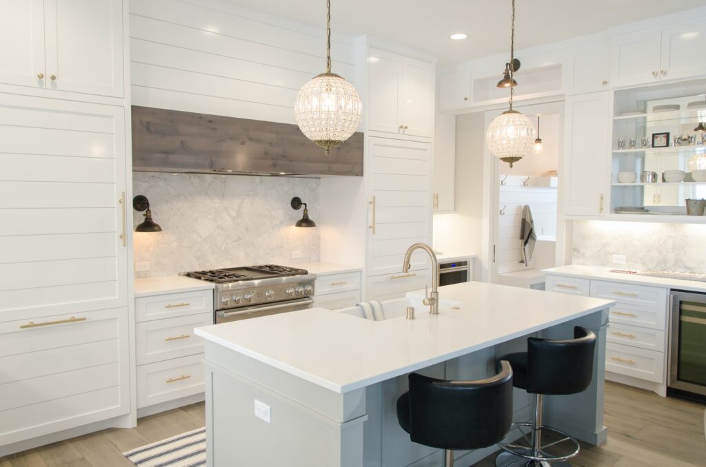 a modern white kitchen with new hardware