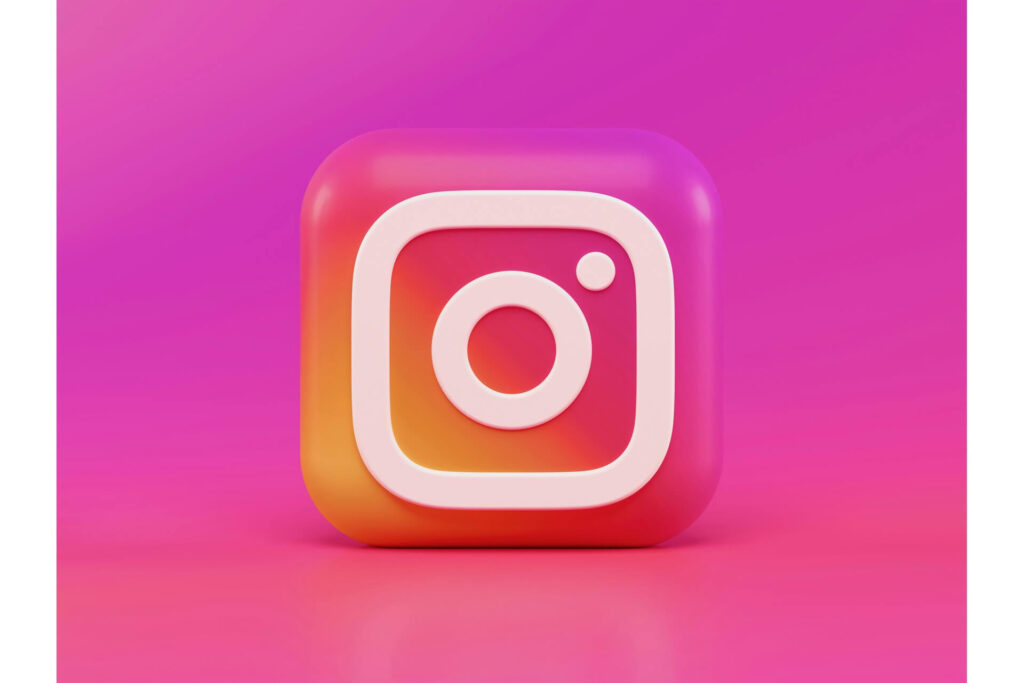 The Instagram logo against a pink background.