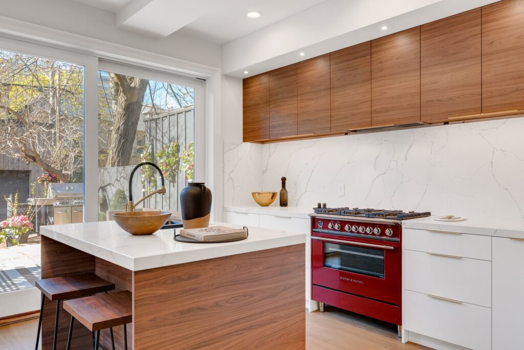 A clean white kitchen with marble designed contact paper backsplash