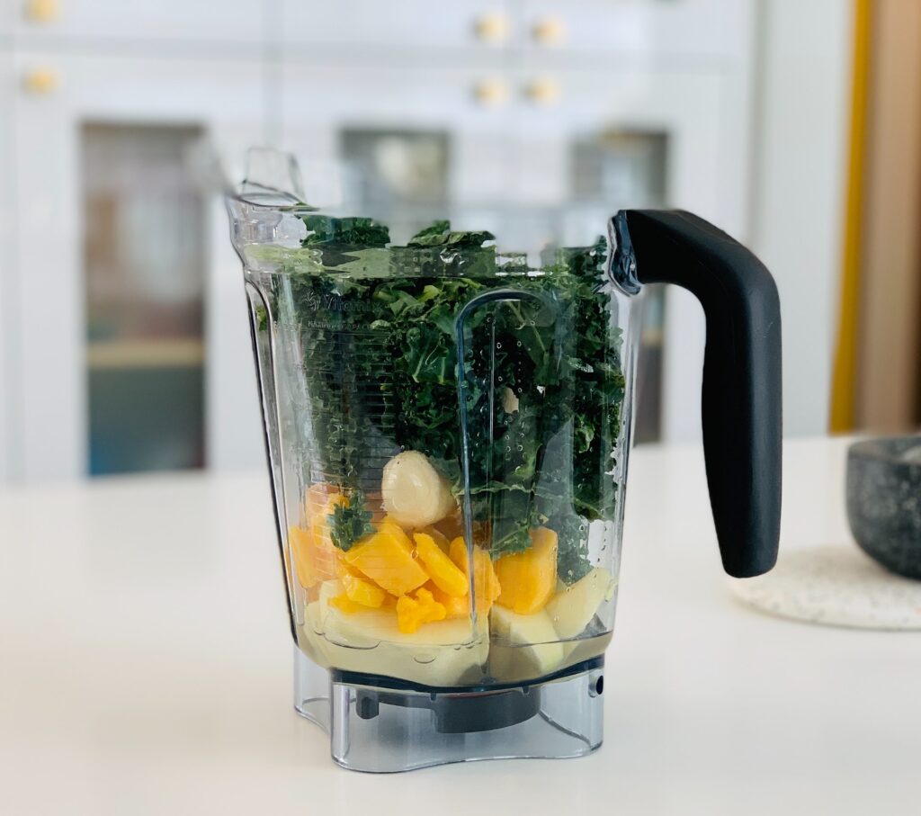 a blender with smoothie ingredients in it