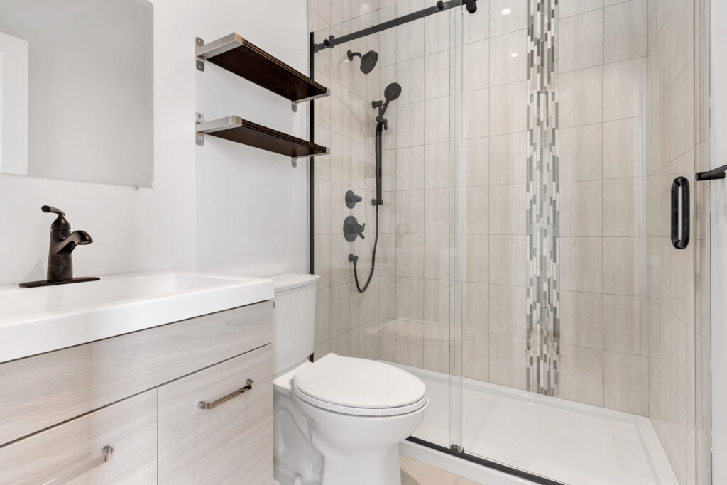 clean bathroom with sink toilet and shower