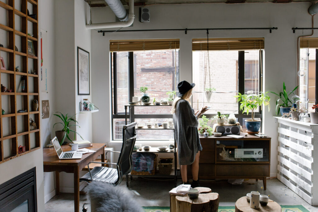 a woman tending to the plants