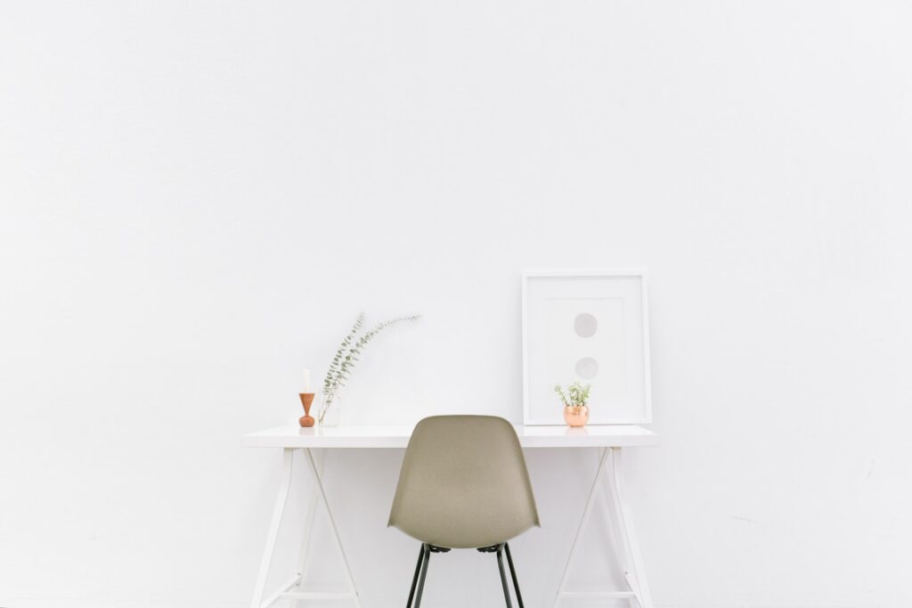 a very clean, uncluttered, and white desk space