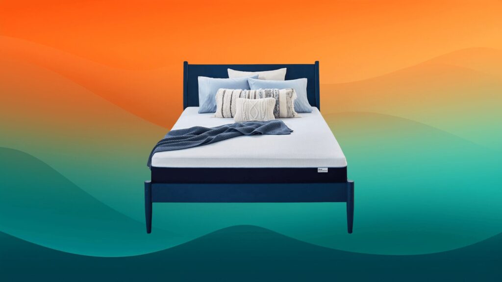 blue and navy mattress on a navy bed frame in front of an orange and teal background