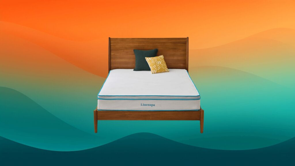 white and blue mattress on a dark wooden bed frame in front of an orange and teal background
