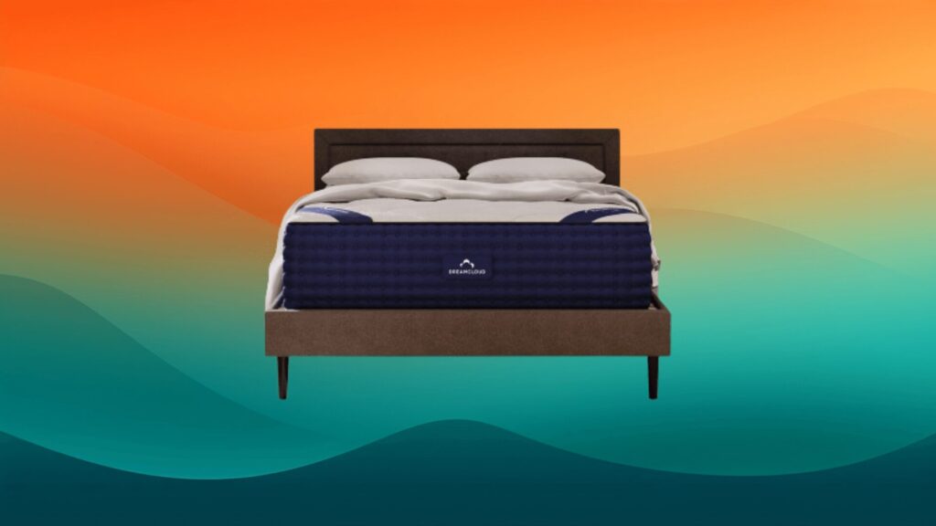 white and blue mattress on a gray bed frame in front of an orange and teal background