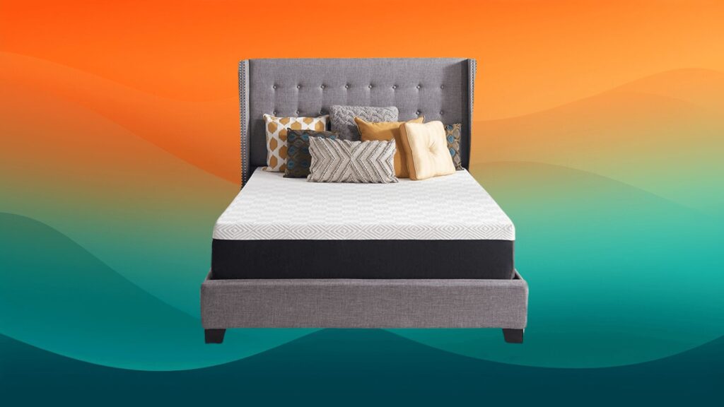 white and black mattress on top of a gray bed frame in front of an orange and teal background