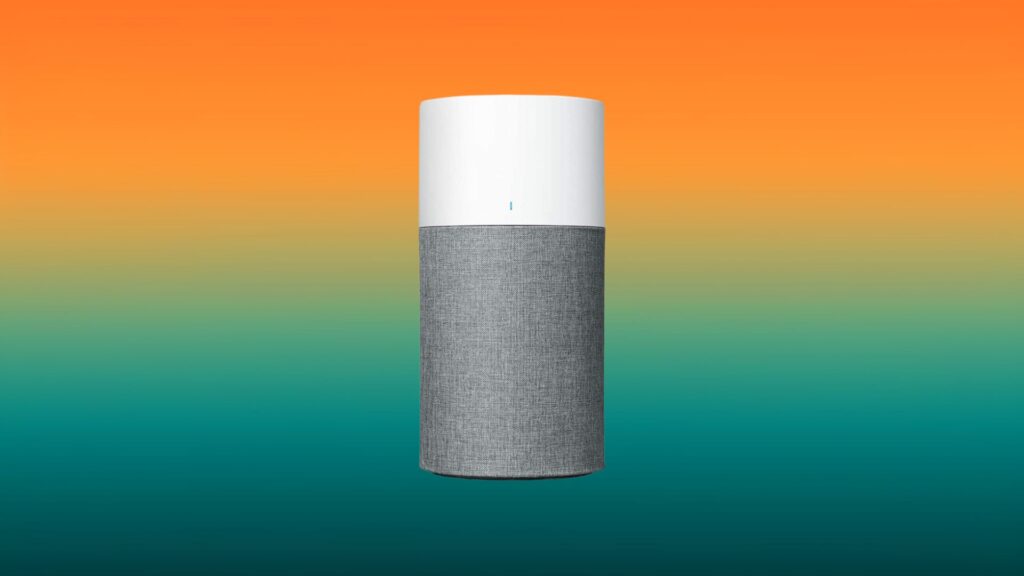 white and gray Blueair 311 air purifier with an orange and teal gradient background