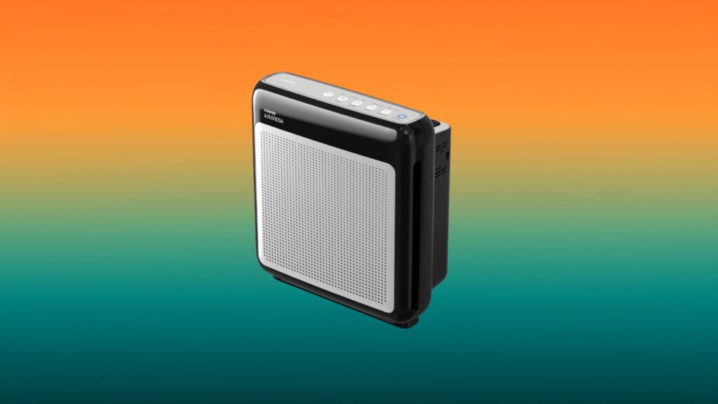 black and gray Coway Airmega air purifier with an orange and teal gradient background
