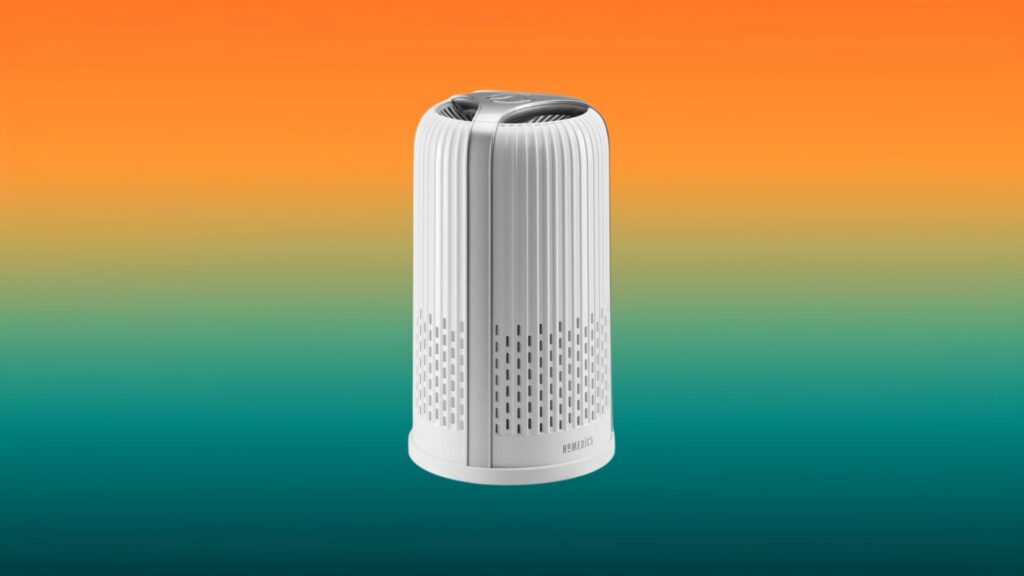 white and gray Homedics TotalClean air purifier with an orange and teal gradient background