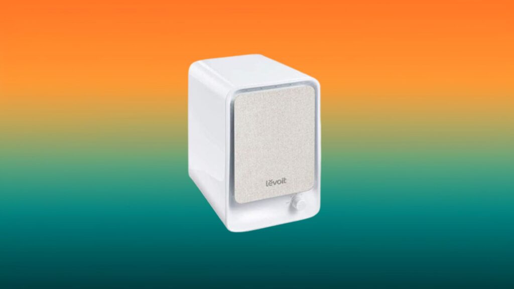 white Levoit air purifier with an orange and teal gradient background