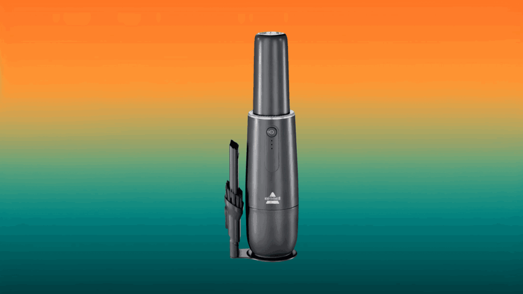 black Bissell apartment vacuum in front of an orange and teal gradient background