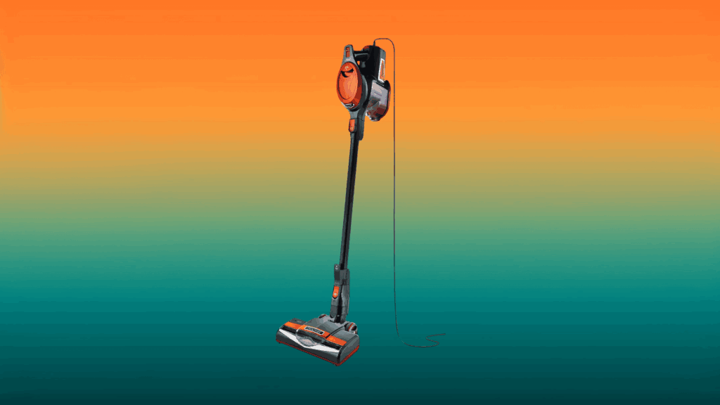black and orange stick vacuum in front of an orange and teal gradient background
