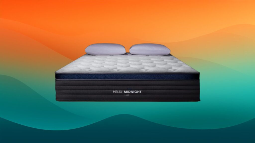 white, blue, and dark gray mattress with two pillows on top with an orange and teal gradient background