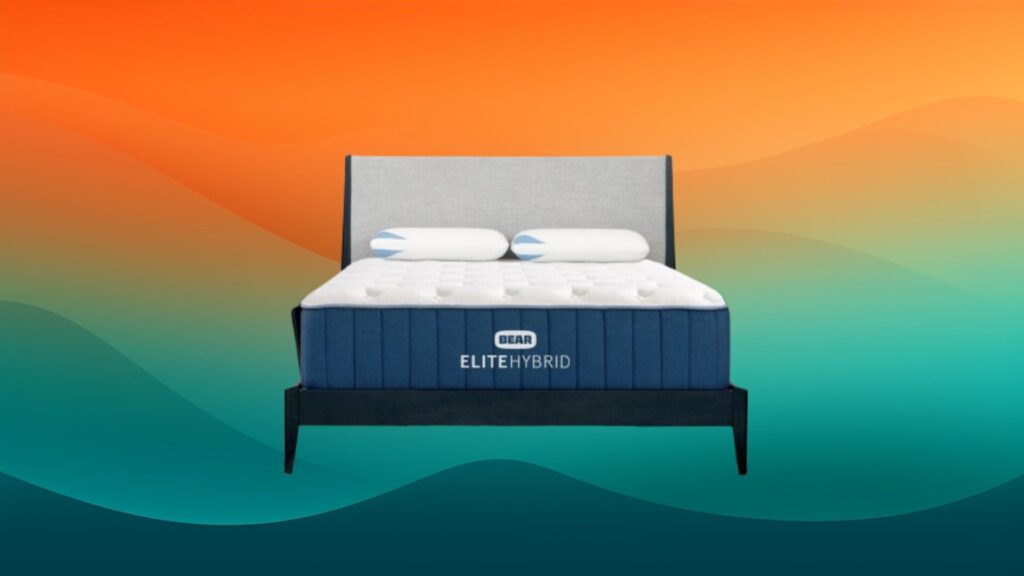 white and blue mattress on a black and light gray bed frame with an orange and teal gradient background
