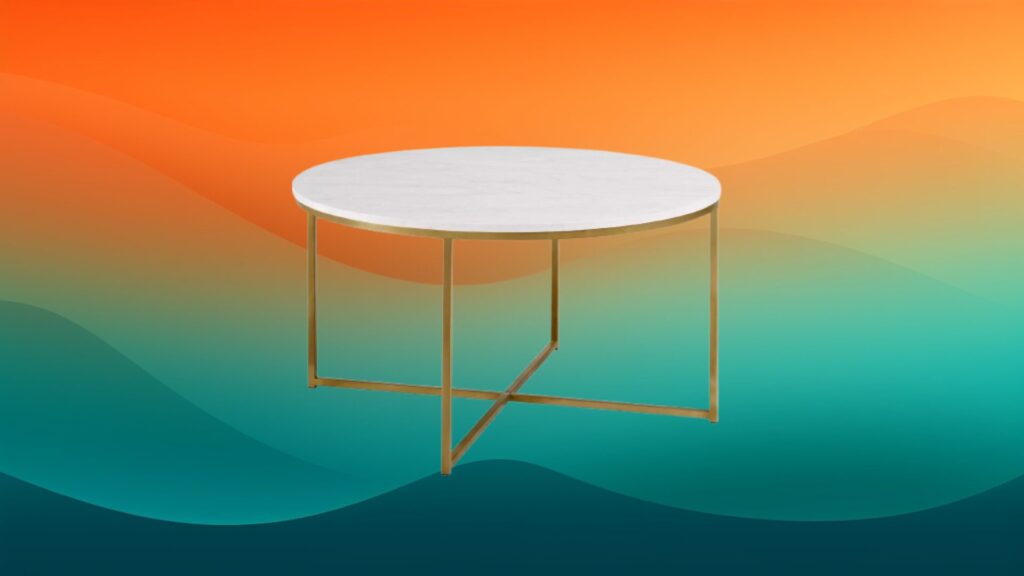 marble topped round gold coffee table in front of an orange and teal gradient background