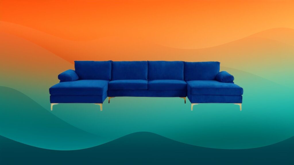 velvet dark blue couch in front of an orange and teal background
