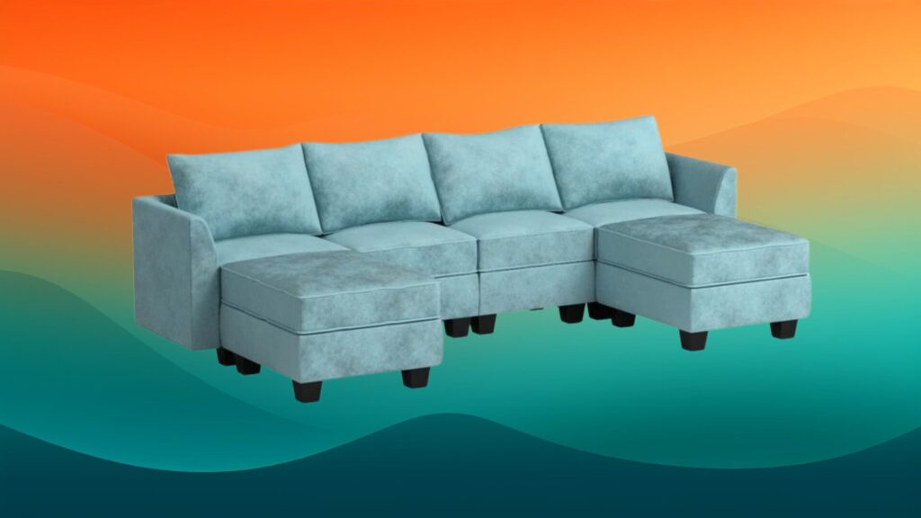 suede light blue couch in front of an orange and teal background