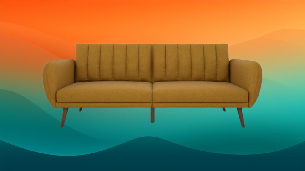 mustard tufted couch in front of an orange and teal background