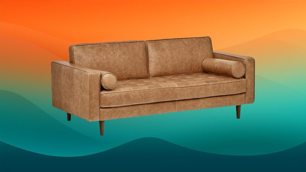 leather couch in front of an orange and teal background