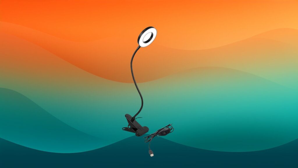 circular black clip on best reading lamps in front of an orange and teal background