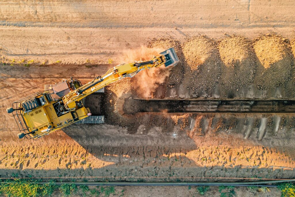 An excavator digging dirt.