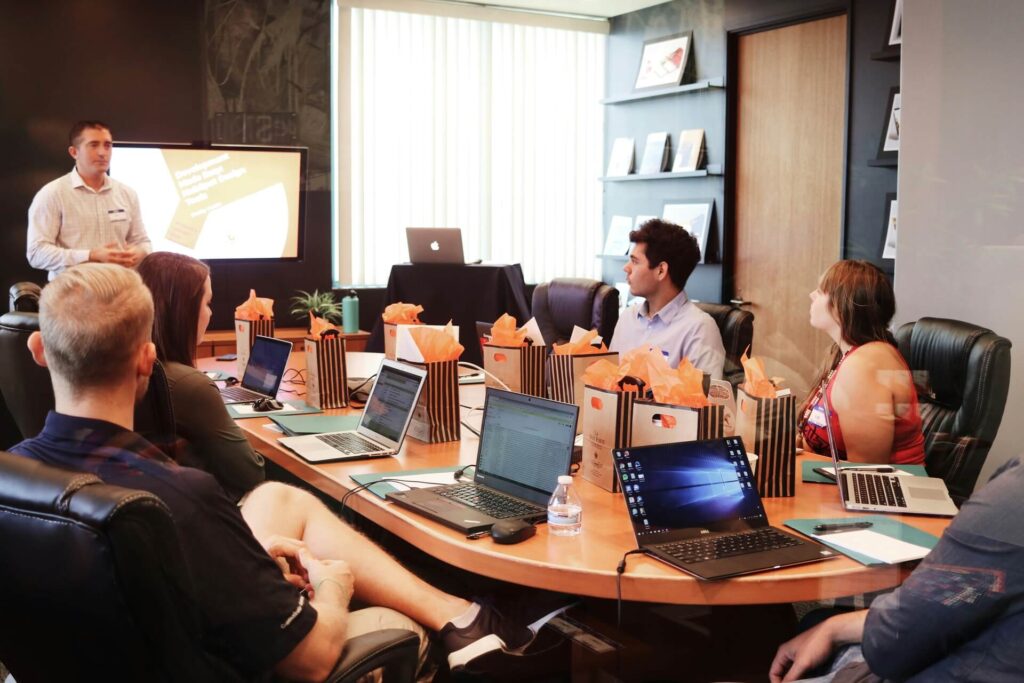 A group of people having a meeting in a conference room.
