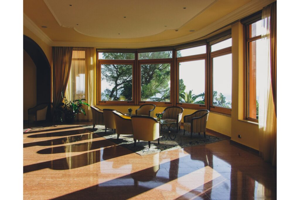 A furniture set next to a bay window