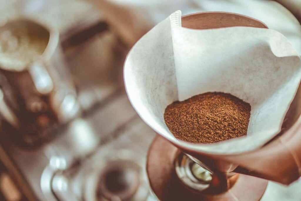 how to make plants grow faster with coffee grounds