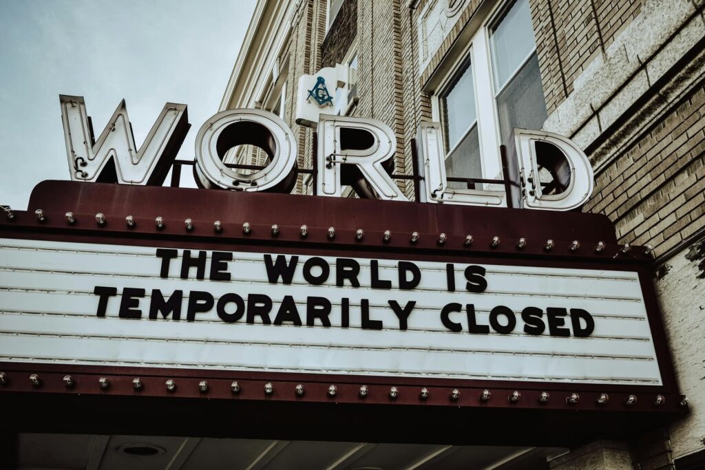A marquee saying The World Is Temporarily Closed.