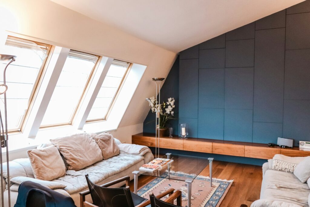 renovated and furnished guest room set up in an attic
