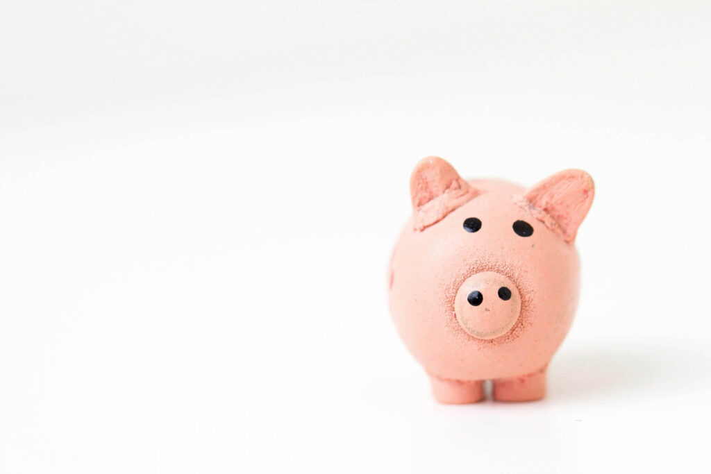 A pink pig figurine with a rough texture
