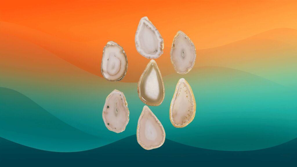 pieces of agate wind chime in front of an orange and teal background
