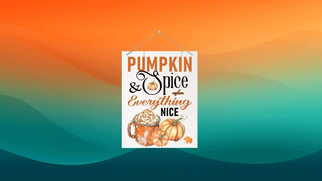 white pumpkin spice sign with pumpkins and cup of pumpkin spice on a board in front of an orange and teal background