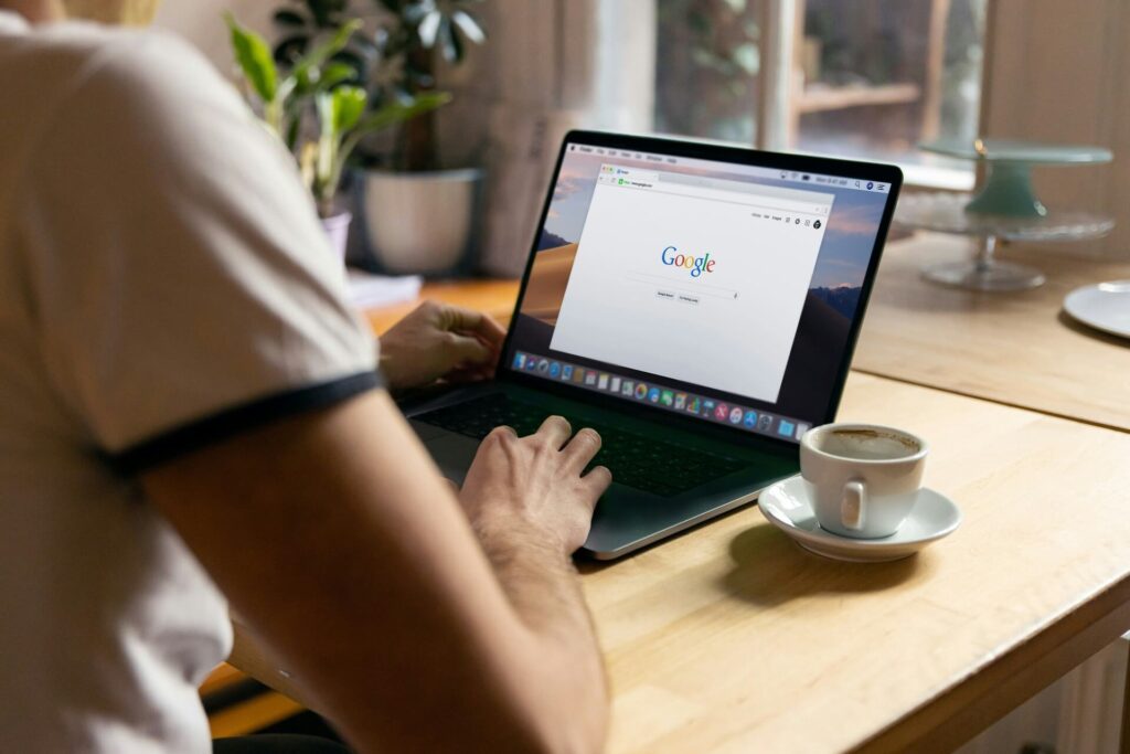 A person sitting at a desk about to Google something.