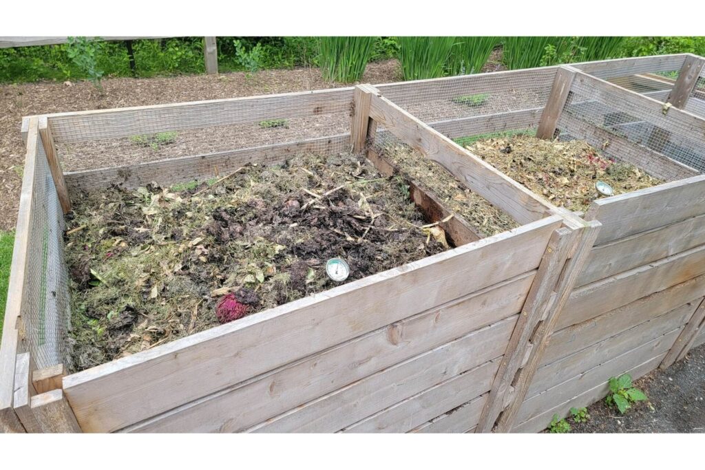 Wooden crates are excellent for keeping a neat composting pile so you can make your own organic mulch.
