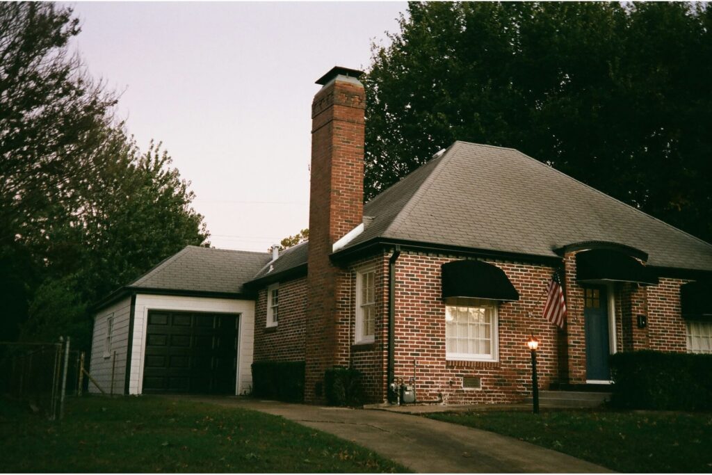 A house with brick walls and chimney.