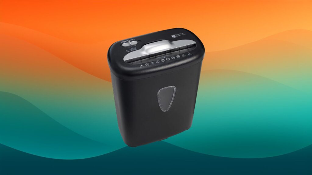 home office organizer black paper shredder in front of an orange and teal gradient background