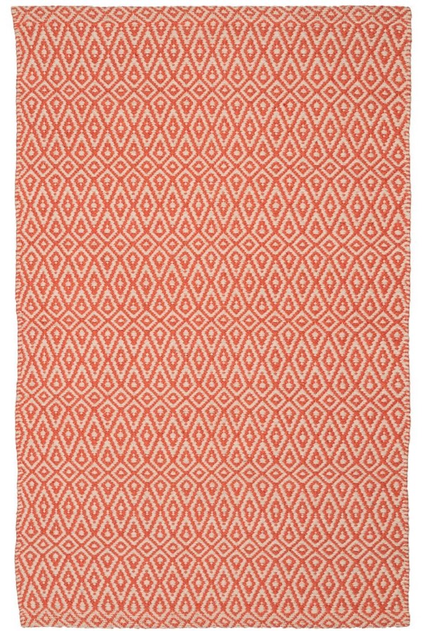 inexpensive rugs - a white and peach pattered rug