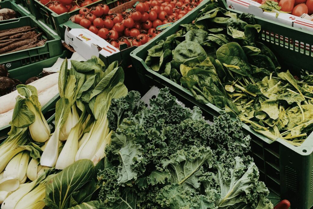 cost of living in arkansas - vegetables, like kale, cabbage and tomatoes in the grocery store